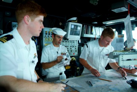 US Navy 050815-N-4772B-044 From left, Navigator Lt.j.g. Timothy Shugert, Quartermaster 2nd Class Jeremy Spaulding and Quartermaster 3rd Class Paul R. Keays help navigate the amphibious dock landing ship