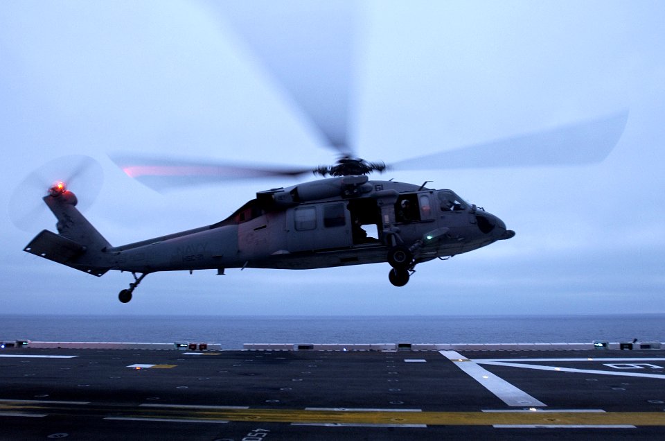 US Navy 050804-N-9866B-046 An MH-60S Seahawk akes off from the flight deck of the amphibious assault ship USS Peleliu (LHA 5)