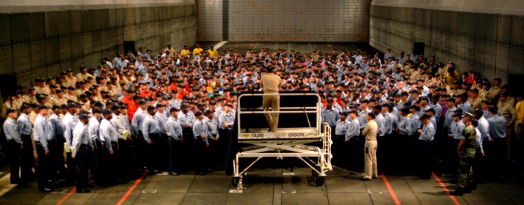 US Navy 050804-N-0962S-196 Master Chief Petty Officer of the Navy (MCPON) Terry Scott speaks to Sailors about the importance of personal readiness at an all hands call in the well deck aboard the amphibious assault ship USS Bat photo