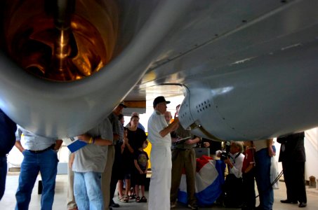 US Navy 050824-N-7676W-069 Chief of Naval Research, Rear Adm. Jay Cohen, explains the underwater discharge water jet prior to the christening of the Advanced Electric Ship Demonstrator (AESD), Sea Jet