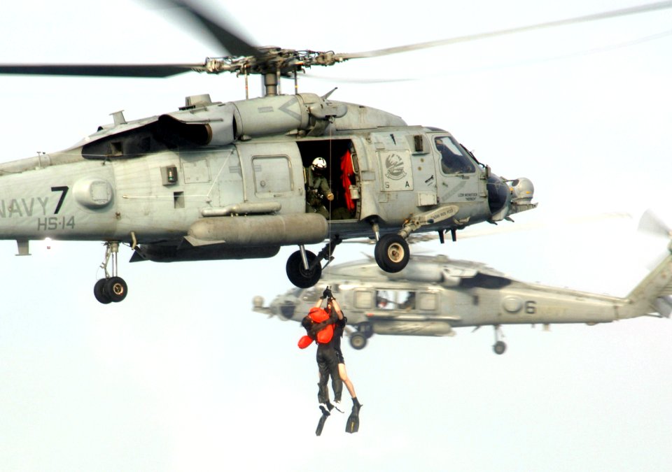 US Navy 050808-F-1740G-001 U.S. Air Force Tech. Sgt. Dawn Ryan is hoisted aboard a U.S. Navy HH-60H Seahawk helicopter