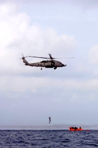 US Navy 050808-F-1740G-007 A U.S. Navy HH-60H Seahawk helicopter, assigned to Helicopter Anti-Submarine Squadron Fourteen (HS-14), performs a simulated rescue