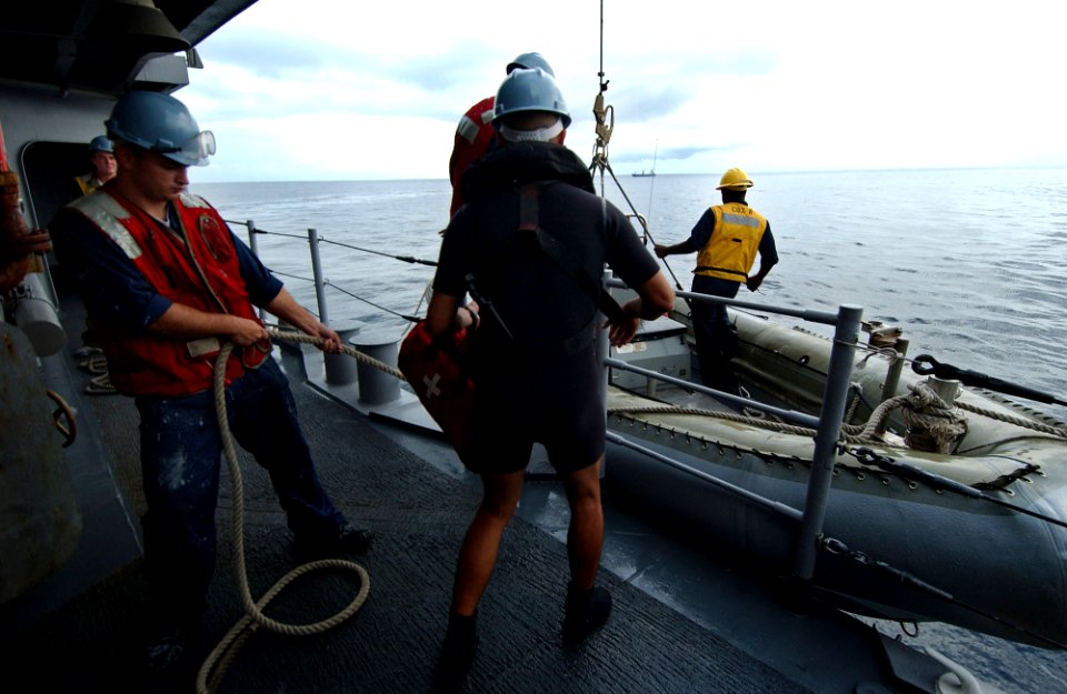 US Navy 050810-F-4883S-011 Sailors aboard the guided missile cruiser USS Thomas S. Gates (CG 51) board a Rigid Hull Inflatable Boat prior to a Visit Board Search and Seize drill as part of PANAMAX 2005