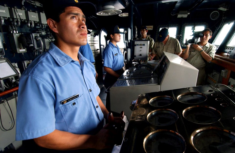 US Navy 050812-F-4883S-069 Helsman Sigifredo Salazar Chavez checks the course and heading of Peruvian frigate BAP Villavisencio (FM 52) in support of PANAMAX 2005