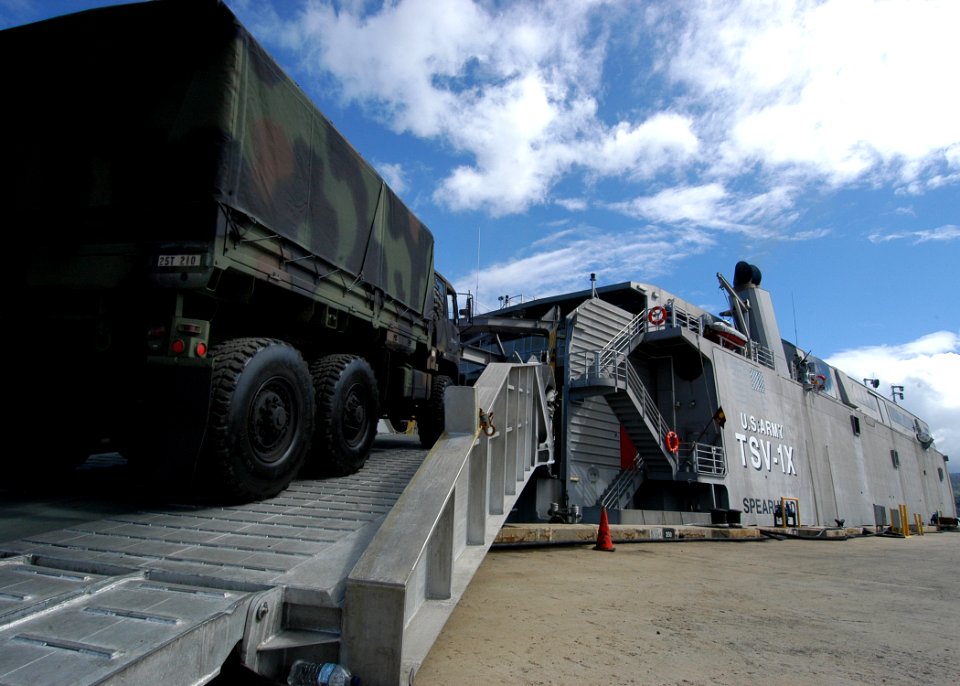 US Navy 050811-N-3019M-003 A U.S. Army Light Medium Tactical Vehicle is loaded onto the U.S. Army ship TSV-1X Spearhead during a capabilities demonstration for local military and civilian leaders on Ford Island at Pearl Harbor