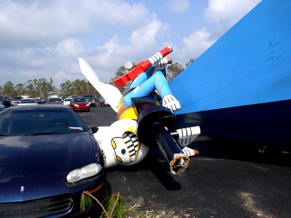 US Navy 050902-N-0000X-013 A giant Seabee statue lays in a parking lot after being blown over by Hurricane Katrina on board Naval Construction Battalion Center (NCBC) Gulfport, Miss