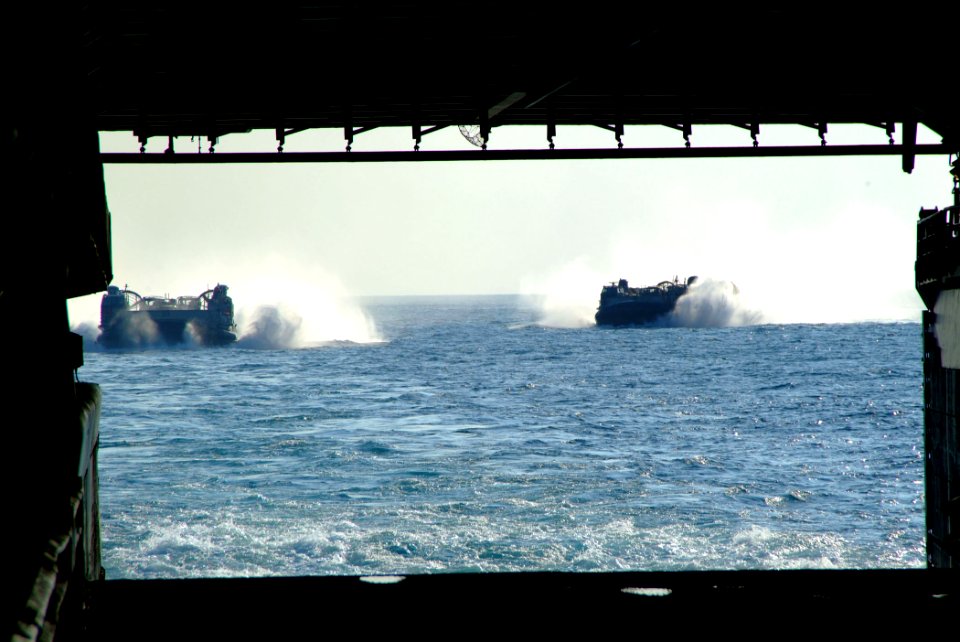 US Navy 050726-N-4772B-018 A pair of Landing Craft, Air Cushions (LCAC) make their way to the well deck of the amphibious dock landing ship USS Harpers Ferry (LSD 49)