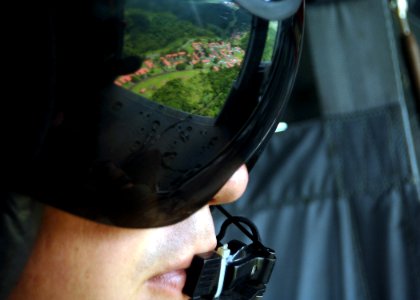 US Navy 050810-N-1464F-005 The landscape of Panama is reflected off the sun visor of Aviation Machinist's Mate 3rd Class Derek Iler, a rescue swimmer assigned to the Dragon Whales of Helicopter Sea Combat Squadron Two Eight (HS