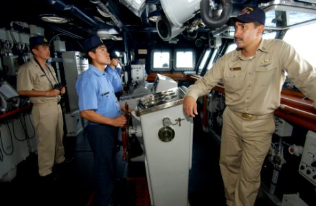 US Navy 050812-F-4883S-093 U.S. Navy Lt. Grant Hartfield, right, stands on the bridge of the Peruvian frigate BAP Villavicencio (FM 52) as he serves as a liaison officer during PANAMAX 2005