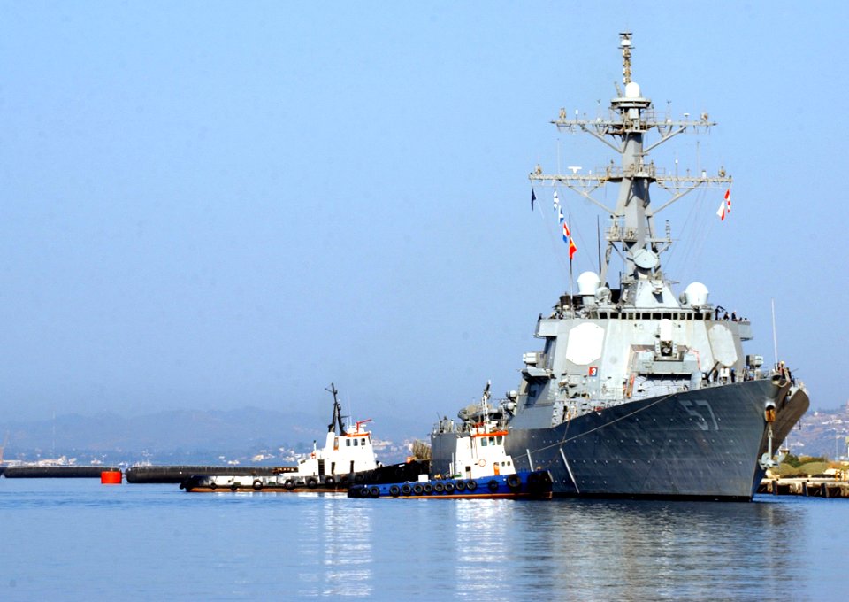 US Navy 050822-N-0780F-001 Tugs assist the guided missile destroyer USS Mitscher (DDG 57) as she arrives at Souda's Marathi NATO Pier Facility for a routine port visit on the Greek island of Crete