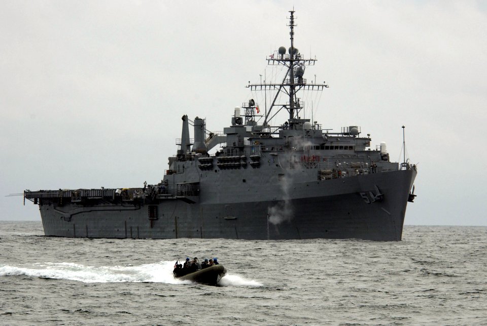 US Navy 050816-F-9085B-008 U.S. Coast Guard's Marine Safety and Security Team (MSST) speeds across the water near USS Ogden (LPD 5), off the coast of Kodiak Island, Alaska