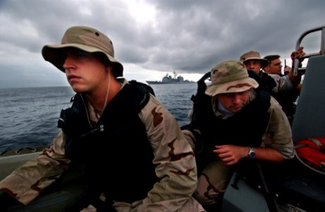 US Navy 050810-F-4883S-071 A Visit Board Search and Seizure team from the U.S. Navy guided missile cruiser USS Thomas S. Gates (CG 51), prepares to board a Panamanian vessel for a simulated medical call during PANAMAX 2005