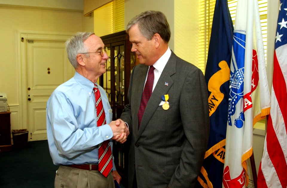 US Navy 050825-N-2568S-002 Secretary of the Navy Gordon England presents the Navy Distinguished Public Service Award to the President of the United Service Organizations (USO), Ned Powell, at the Pentagon