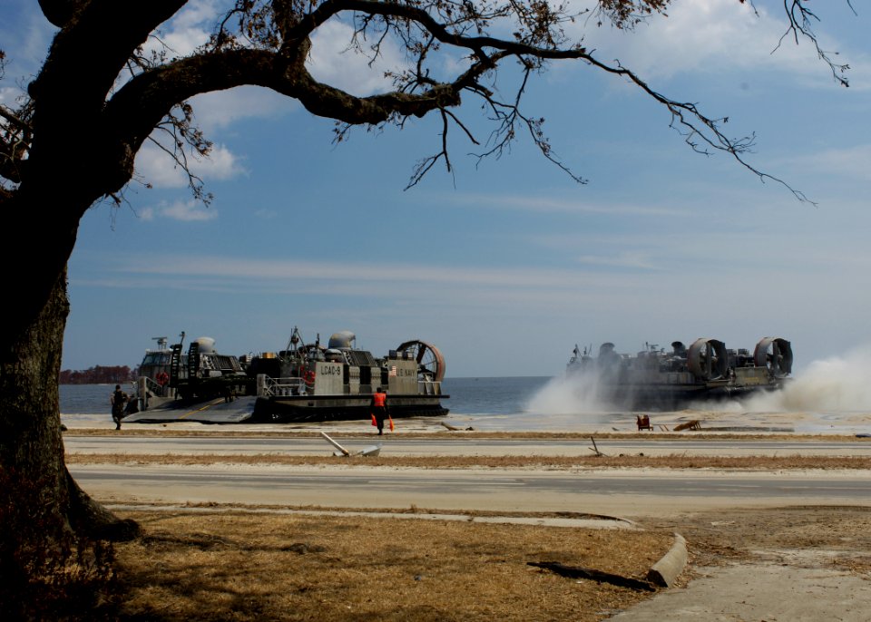 US Navy 050906-N-6925C-002 A U.S. Navy Landing Craft, Air Cushion (LCAC), assigned to Assault Craft Unit Four (ACU-4), arrives on the beach in Biloxi, Miss., to offload relief supplies for the victims of Hurricane Katrina