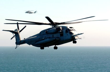 US Navy 050907-N-9866B-008 A U.S. Marine Corps CH-53E Super Stallion helicopter prepares to for landing aboard the amphibious assault ship USS Peleliu (LHA 5)