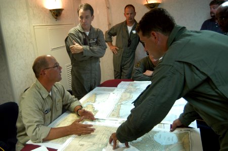 US Navy 050901-N-8154G-011 Executive Officer, Naval Surface Warfare Command (NSWC), Cmdr. Jeff Prater, left, discusses points of entry into the Biloxi, Miss. area via the Mississippi Sound with Landing Craft, Air Cushion (LCAC)