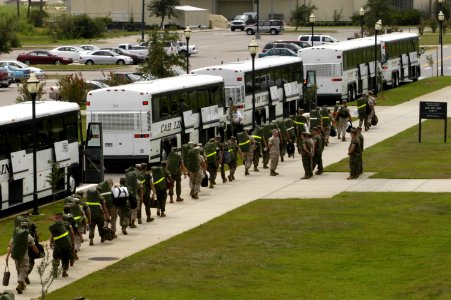 US Navy 050828-N-5328N-070 Marines assigned to Aviation Maintenance Squadron Two (AMS-2) on board Naval Air Station Pensacola, Fla., board buses which will evacuate them to Marine Corps Logistics Base Albany, Ga