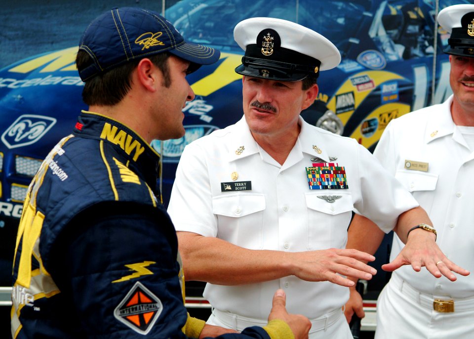 US Navy 050813-N-0962S-109 Master Chief Petty Officer of the Navy (MCPON) Terry Scott speaks with David Stremme prior to the NASCAR Busch Series Zippo 200 race at Watkins Glen International