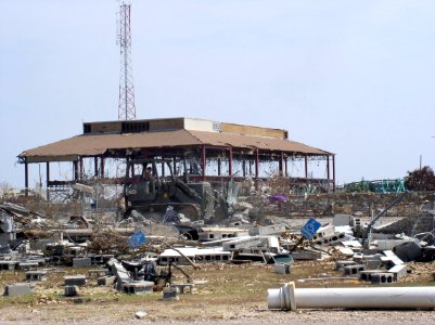 US Navy 050902-N-0000X-017 A U.S. Navy Seabee uses a bulldozer to remove debris from Hurricane Katrina on board on board Naval Construction Battalion Center (NCBC) Gulfport, Miss