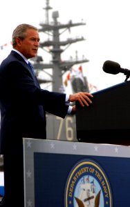 US Navy 050830-N-5549O-064 The Nimitz-class aircraft carrier USS Ronald Reagan (CVN 76) serves as backdrop as President George W. Bush speaks to a crowd of Sailors, Marines, and veterans commemorating the 60th anniversary of th