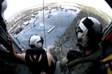 US Navy 050831-N-8154G-057 A Search and Rescue (SAR) swimmer assigned to Helicopter Sea Combat Squadron Two Eight (HSC-28), prepare to assist in a rescue of a Hurricane Katrina survivor in Louisiana