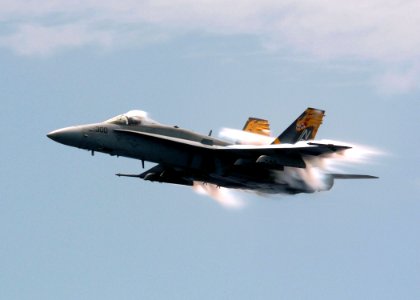 US Navy 050817-N-3488C-152 An F-A-18C Hornet conducts a high-speed pass prior to breaking the speed of sound