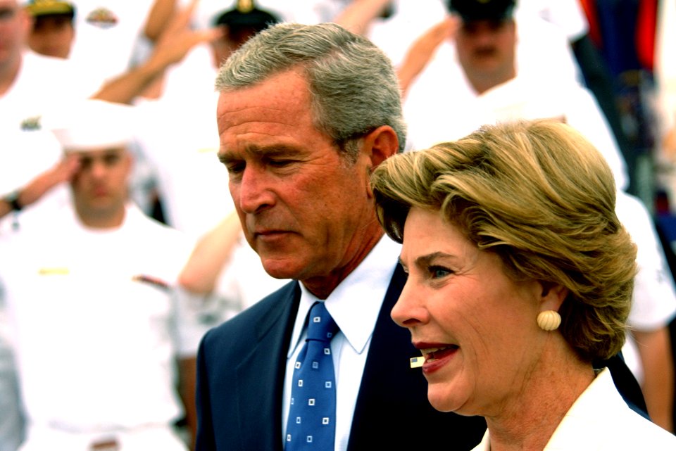 US Navy 050830-N-5549O-024 President George W. Bush and First Lady Laura Bush walk past a crowd of Sailors prior to delivering a speech in commemoration of the 60th anniversary of the victory over Japan (VJ Day) during World Wa