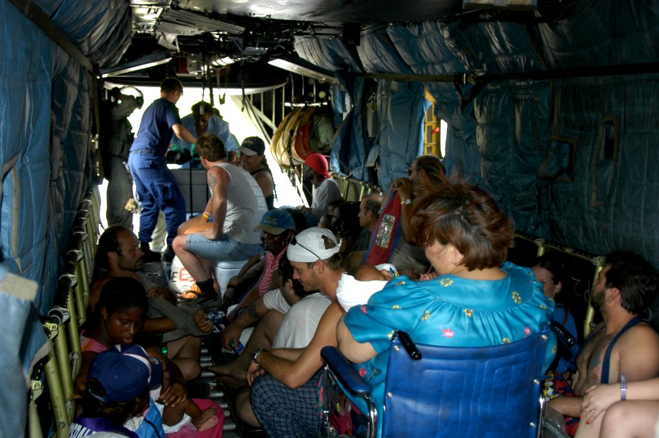 US Navy 050902-N-1467R-059 U.S. Navy air crewmen assigned to Helicopter Mine Countermeasures Squadron One Five (HM-15) stationed at Naval Air Station Corpus Christi, Texas, attend to hurricane victims on board an MH-53E helicop