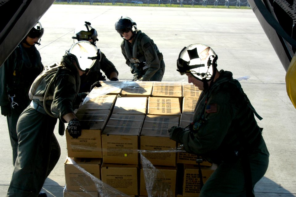 US Navy 050902-N-1467R-005 U.S. Navy Air Crewmen assigned to Helicopter Mine Countermeasures Squadron One Five (HM-15) stationed at Naval Air Station Corpus Christi, Texas off load a pallet loaded with Meals Ready to Eat