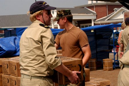 US Navy 050912-N-0793G-003 U.S. Navy Seabees, Royal Dutch Sailors, and Marines from Mexico load food and water into cars at a Red Cross distribution center in D'Iberville, Miss