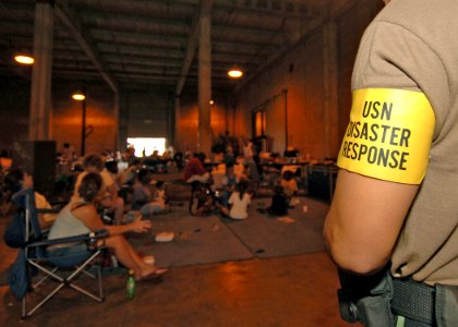 US Navy 050903-N-4374S-005 A Sailor assigned to Naval Construction Battalion Center, Miss., provides security for the military dependents and civilian workers in an equipment warehouse