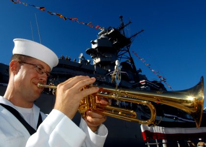 US Navy 050902-N-3019M-003 Musician 1st Class Gui Gregg practices as the primary bugler during the 60th anniversary of the end of World War II ceremony aboard the Battleship Missouri Memorial at Pearl Harbor