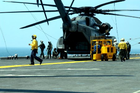 US Navy 050829-N-8154G-082 Crew members assigned to the Blackhawks of Helicopter Mine Countermeasures Squadron Fifteen (HM-15), stationed at Naval Air Station Corpus Christi, Texas, prepare to unload personnel and equipment