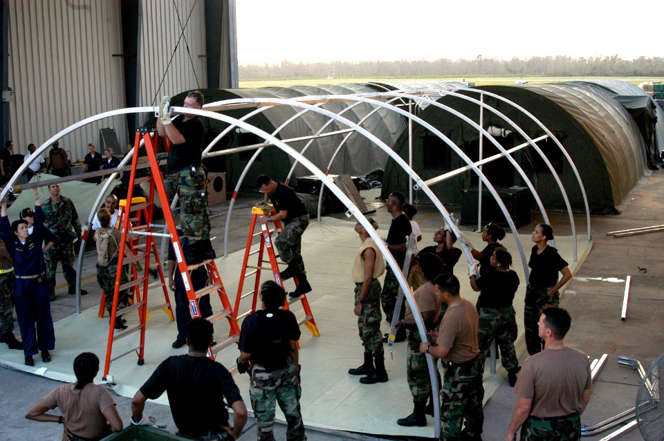 US Navy 050905-N-8154G-103 U.S. Navy personnel assigned to Casualty Receiving and Treatment Ship Team Eight (CRTS-8), based out of Naval Hospital Jacksonville, Florida, assist Army and Air Force Reservists as they set up a fiel