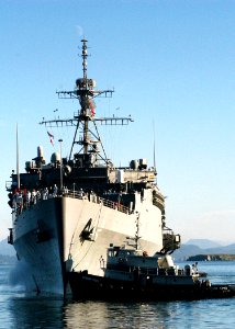 US Navy 050813-N-0793G-025 The amphibious transport dock USS Ogden (LPD 5) is assisted by a harbor tug at Kodiak Island, Alaska as the ship arrives for a port visit during the Alaska Shield-Northern Edge joint exercise