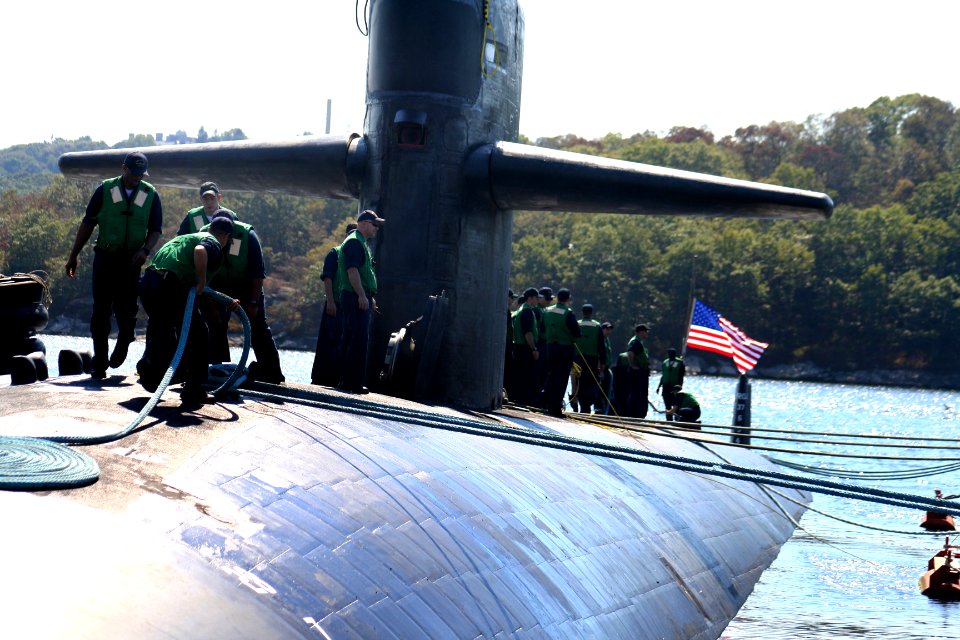 US Navy 050908-N-0653J-003 Sailors aboard the Los Angeles-class attack submarine USS Augusta (SSN 710) work together to moor their submarine to the pier