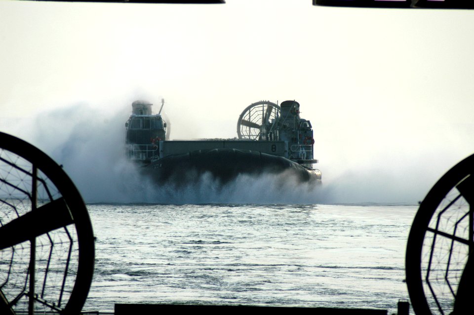 US Navy 050901-N-8154G-208 A Landing Craft, Air Cushion (LCAC) prepares to enter the well deck of the amphibious assault ship USS Bataan (LHD 5) after traveling from Pensacola, Fla
