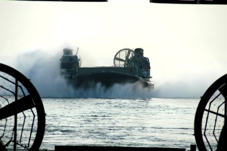 US Navy 050901-N-8154G-208 A Landing Craft, Air Cushion (LCAC) prepares to enter the well deck of the amphibious assault ship USS Bataan (LHD 5) after traveling from Pensacola, Fla photo