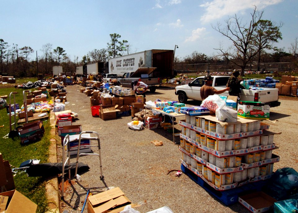 US Navy 050908-N-4374S-007 U.S. Navy Seabees assigned to Naval Mobile Construction Battalion Seven (NMCB-7), distribute relief supplies to the residents of Harrison County