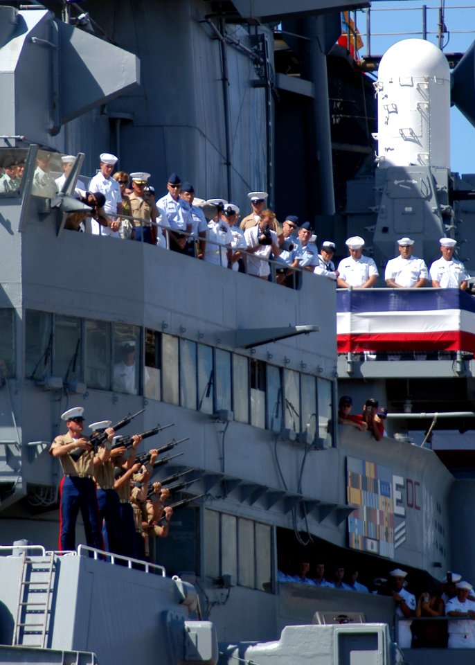 US Navy 050902-N-3019M-013 A U.S. Marine Corps rifle detail fires off a salute during the 60th anniversary of the end of World War II ceremony aboard the Battleship Missouri Memorial at Pearl Harbor