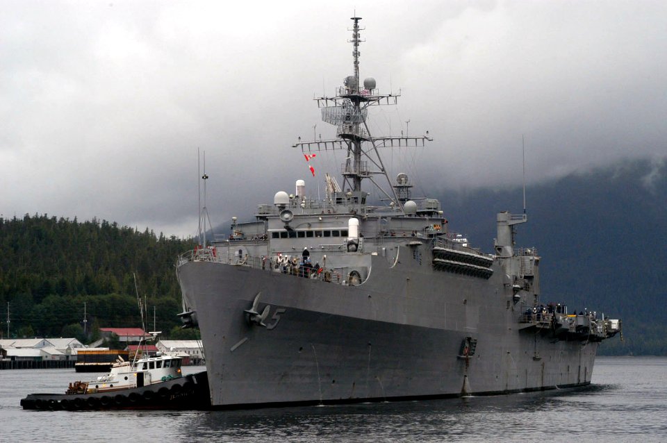 US Navy 050820-N-0793G-205 The amphibious transport dock USS Ogden (LPD 5) is assisted by tug boats as she arrives at Ketchikan for a three-day port visit after successfully completing Northern Edge 2005