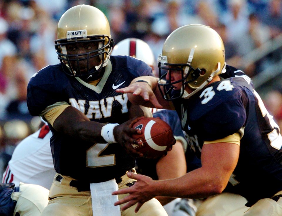 US Navy 050910-N-9693M-001 U.S. Naval Academy Midshipmen Quarterback Lamar Owens hands off to fullback Matt Hall in the first quarter of play against the Stanford Cardinals