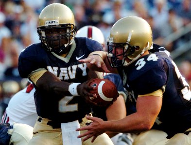 US Navy 050910-N-9693M-001 U.S. Naval Academy Midshipmen Quarterback Lamar Owens hands off to fullback Matt Hall in the first quarter of play against the Stanford Cardinals