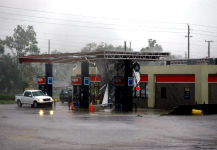 US Navy 050829-F-1279W-023 An Exxon station in Florida remains open despite loosing its roof during the forceful winds Hurricane Katrina brought into the area