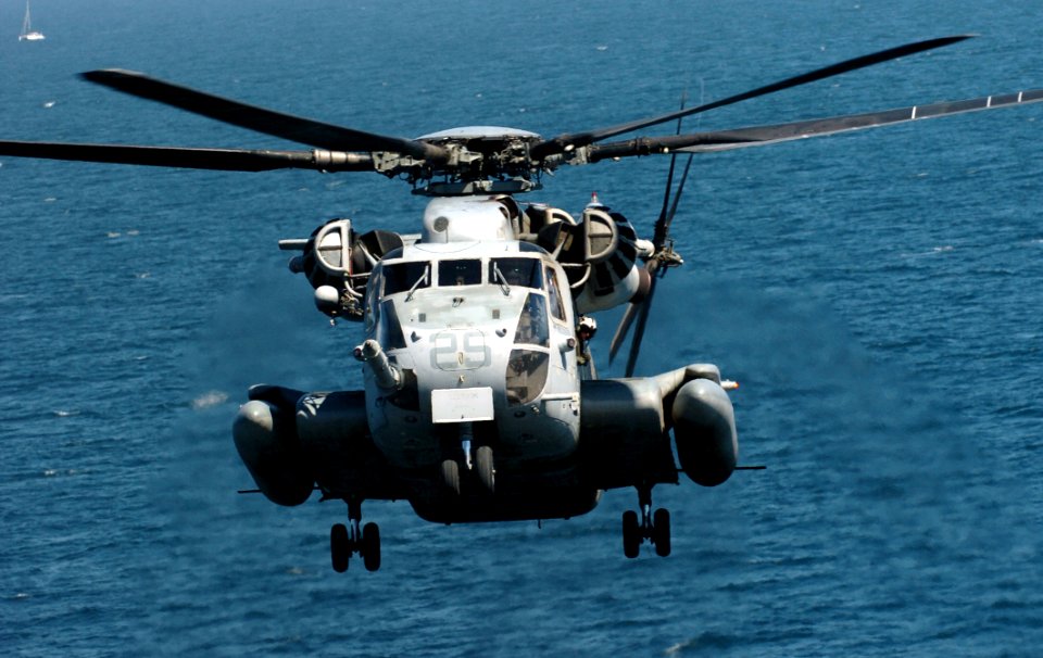 US Navy 050907-N-9866B-003 A U.S. Marine Corps CH-53E Super Stallion helicopter prepares to for landing aboard the amphibious assault ship USS Peleliu (LHA 5)