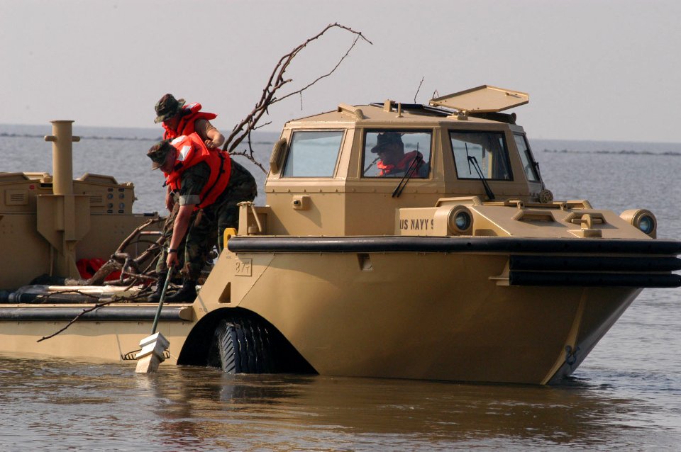 US Navy 050914-N-0793G-002 Beachmasters use a Logistical Amphibious Recovery Craft (LARC) amphibious vehicle assigned to Beachmaster Unit Two (BMU-2) to remove debris out of the water