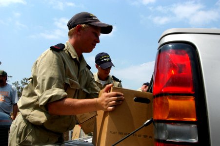 US Navy 050912-N-1467R-028 A Dutch Sailor loads a box of water as part of the voluntary efforts to help the victims of Hurricane Katrina at the First Baptist Church in Biloxi