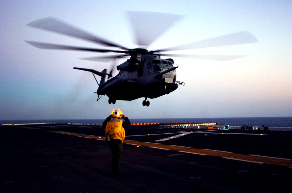 US Navy 050914-N-9866B-037 A U.S. Marine Corps CH-53 Sea Stallion helicopter, assigned to Marine Medium Helicopter Squadron One Six Six (HMM-166), lands on the flight deck of the amphibious assault ship USS Peleliu (LHA 5)