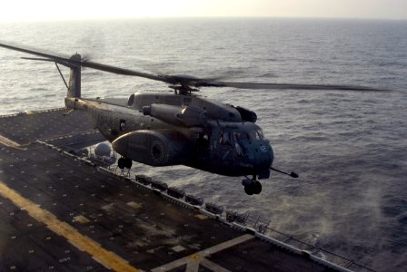 US Navy 050830-N-8154G-037 An MH-53E Sea Dragon helicopter takes off from the flight deck of the amphibious assault ship USS Bataan (LHD 5) to assist with Hurricane Katrina relief efforts