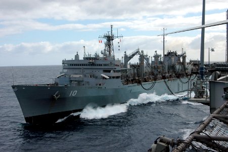 US Navy 051005-N-3570S-003 The Military Sealift Command (MSC) fast combat support ship USNS Bridge (T-AOE 10) pulls alongside USS Nimitz (CVN 68) and connects fuel lines during a replenishment at sea